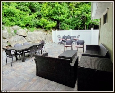 Completely renovated in 2020 this year round home sits on the on Lake Lackawanna Golf Course in New Jersey - for sale on GolfHomes.com, golf home, golf lot