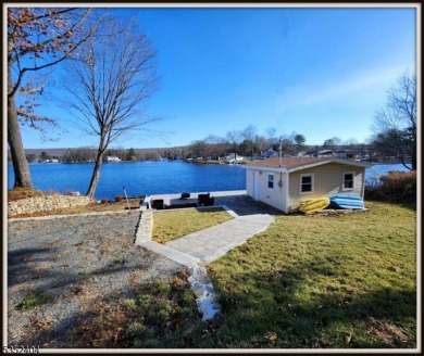 Completely renovated in 2020 this year round home sits on the on Lake Lackawanna Golf Course in New Jersey - for sale on GolfHomes.com, golf home, golf lot