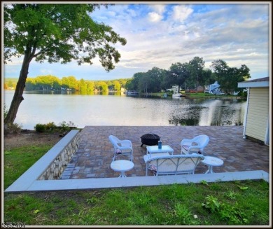 Completely renovated in 2020 this year round home sits on the on Lake Lackawanna Golf Course in New Jersey - for sale on GolfHomes.com, golf home, golf lot