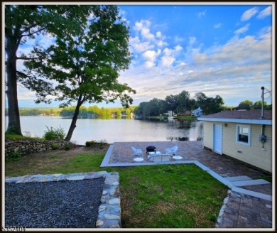 Completely renovated in 2020 this year round home sits on the on Lake Lackawanna Golf Course in New Jersey - for sale on GolfHomes.com, golf home, golf lot