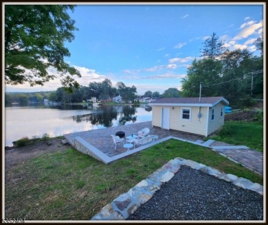 Completely renovated in 2020 this year round home sits on the on Lake Lackawanna Golf Course in New Jersey - for sale on GolfHomes.com, golf home, golf lot
