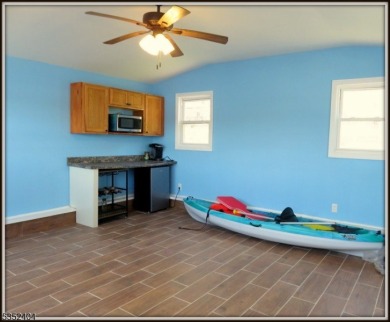 Completely renovated in 2020 this year round home sits on the on Lake Lackawanna Golf Course in New Jersey - for sale on GolfHomes.com, golf home, golf lot