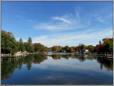 Completely renovated in 2020 this year round home sits on the on Lake Lackawanna Golf Course in New Jersey - for sale on GolfHomes.com, golf home, golf lot