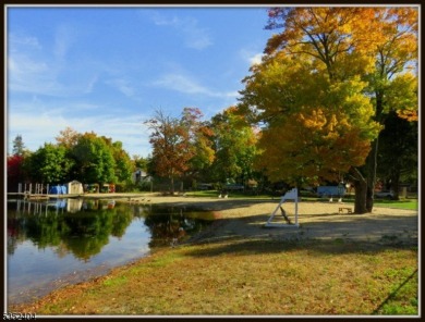 Completely renovated in 2020 this year round home sits on the on Lake Lackawanna Golf Course in New Jersey - for sale on GolfHomes.com, golf home, golf lot