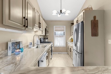 This beautifully updated end-unit condo offers effortless on Holly Tree Country Club in South Carolina - for sale on GolfHomes.com, golf home, golf lot