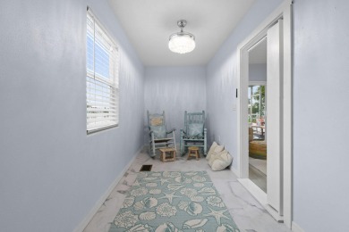 Discover resort-style living on the scenic shores of Lake on Blue Cypress Golf and RV Resort in Florida - for sale on GolfHomes.com, golf home, golf lot