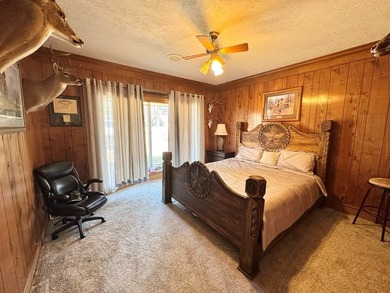 Situated in the heart of Rayburn Country, this elegant golf on Rayburn Country Club in Texas - for sale on GolfHomes.com, golf home, golf lot