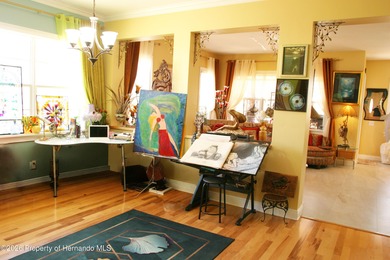 One or more photo(s) has been virtually staged. Nestled on a on Southern Hills Plantation Club in Florida - for sale on GolfHomes.com, golf home, golf lot