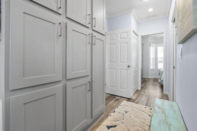 Discover resort-style living on the scenic shores of Lake on Blue Cypress Golf and RV Resort in Florida - for sale on GolfHomes.com, golf home, golf lot