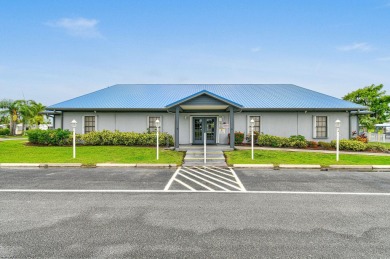 Discover resort-style living on the scenic shores of Lake on Blue Cypress Golf and RV Resort in Florida - for sale on GolfHomes.com, golf home, golf lot