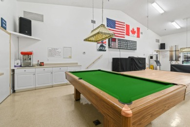 Discover resort-style living on the scenic shores of Lake on Blue Cypress Golf and RV Resort in Florida - for sale on GolfHomes.com, golf home, golf lot