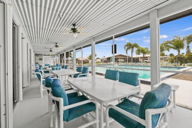 Discover resort-style living on the scenic shores of Lake on Blue Cypress Golf and RV Resort in Florida - for sale on GolfHomes.com, golf home, golf lot