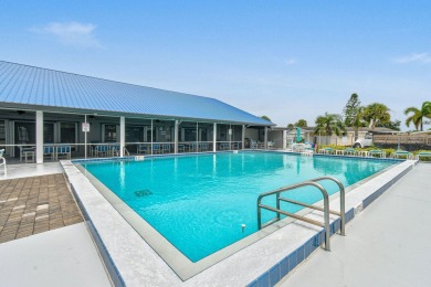 Discover resort-style living on the scenic shores of Lake on Blue Cypress Golf and RV Resort in Florida - for sale on GolfHomes.com, golf home, golf lot