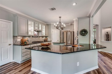 Nestled in the heart of Coppell, this beautifully renovated on Riverchase Golf Club in Texas - for sale on GolfHomes.com, golf home, golf lot