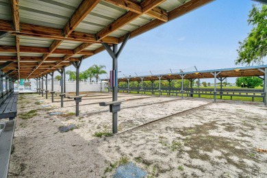 Discover resort-style living on the scenic shores of Lake on Blue Cypress Golf and RV Resort in Florida - for sale on GolfHomes.com, golf home, golf lot