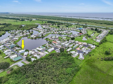 Discover resort-style living on the scenic shores of Lake on Blue Cypress Golf and RV Resort in Florida - for sale on GolfHomes.com, golf home, golf lot