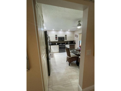 Spacious and bright 2nd floor unit in a 55+ gated community with on Indian Spring Golf and Country Club in Florida - for sale on GolfHomes.com, golf home, golf lot