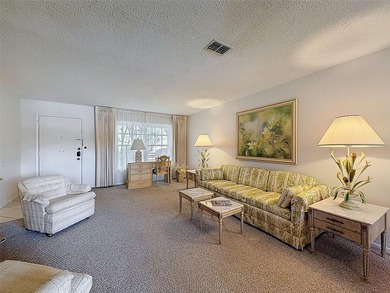 Welcome to this waterfront well-maintained two-bedroom, two-bath on Highland Lakes Executive Golf Course in Florida - for sale on GolfHomes.com, golf home, golf lot