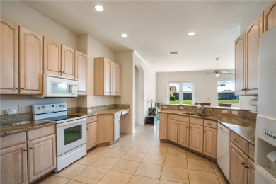 Move In Ready Single Story Villa offering 3 Bedrooms plus a Den on Oak Harbor Country Club in Florida - for sale on GolfHomes.com, golf home, golf lot