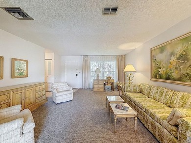 Welcome to this waterfront well-maintained two-bedroom, two-bath on Highland Lakes Executive Golf Course in Florida - for sale on GolfHomes.com, golf home, golf lot