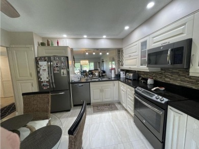 Spacious and bright 2nd floor unit in a 55+ gated community with on Indian Spring Golf and Country Club in Florida - for sale on GolfHomes.com, golf home, golf lot