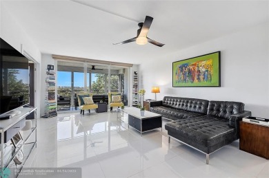 Nestled in a charming five-story condo community, this home on Palm-Aire Country Club and Resort - Palms in Florida - for sale on GolfHomes.com, golf home, golf lot