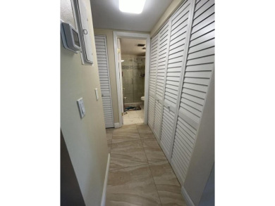 Spacious and bright 2nd floor unit in a 55+ gated community with on Indian Spring Golf and Country Club in Florida - for sale on GolfHomes.com, golf home, golf lot