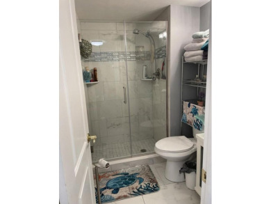 Spacious and bright 2nd floor unit in a 55+ gated community with on Indian Spring Golf and Country Club in Florida - for sale on GolfHomes.com, golf home, golf lot