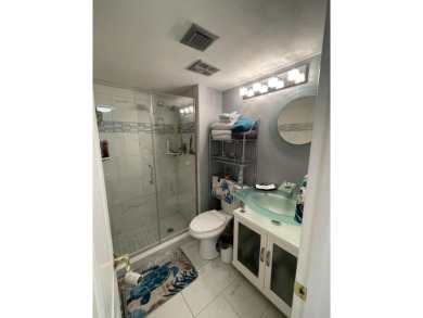 Spacious and bright 2nd floor unit in a 55+ gated community with on Indian Spring Golf and Country Club in Florida - for sale on GolfHomes.com, golf home, golf lot