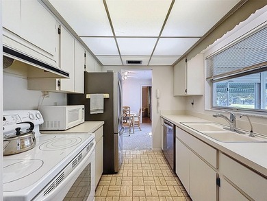 Welcome to this waterfront well-maintained two-bedroom, two-bath on Highland Lakes Executive Golf Course in Florida - for sale on GolfHomes.com, golf home, golf lot