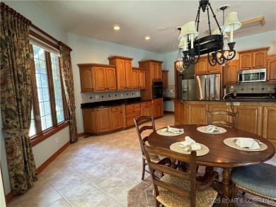 Discover the perfect blend of elegance and comfort in this on The Oaks Golf Course in Missouri - for sale on GolfHomes.com, golf home, golf lot