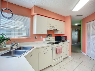 Welcome Home!  This amazing second-floor condo is located in on Isla Del Sol Yacht and Country Club in Florida - for sale on GolfHomes.com, golf home, golf lot