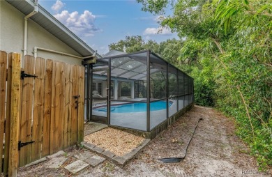 BEAUTIFUL SPACIOUS POOL HOME! This 4 bedroom 2 1/2 baths & 2 car on Sugarmill Woods Golf and Country Club in Florida - for sale on GolfHomes.com, golf home, golf lot