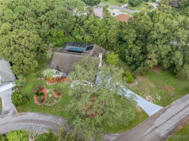 BEAUTIFUL SPACIOUS POOL HOME! This 4 bedroom 2 1/2 baths & 2 car on Sugarmill Woods Golf and Country Club in Florida - for sale on GolfHomes.com, golf home, golf lot