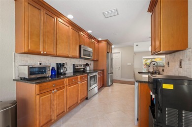 This beautifully updated 3-bedroom, 2-bath, 2-car garage home in on Saint Andrews South Golf Club in Florida - for sale on GolfHomes.com, golf home, golf lot