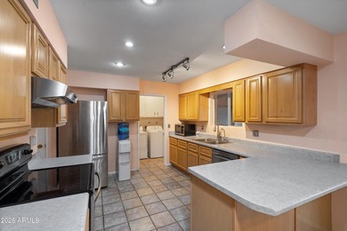 This charming Gemini twin home at 10229 N 108th Ave offers on Sun City Lakes West and East in Arizona - for sale on GolfHomes.com, golf home, golf lot