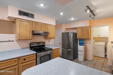 This charming Gemini twin home at 10229 N 108th Ave offers on Sun City Lakes West and East in Arizona - for sale on GolfHomes.com, golf home, golf lot