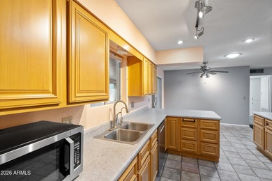 This charming Gemini twin home at 10229 N 108th Ave offers on Sun City Lakes West and East in Arizona - for sale on GolfHomes.com, golf home, golf lot