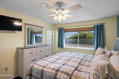 This charming Gemini twin home at 10229 N 108th Ave offers on Sun City Lakes West and East in Arizona - for sale on GolfHomes.com, golf home, golf lot