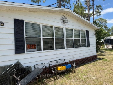 This lovely, manufactured home on leased land.   Priced to sell on Pine Lakes Country Club in Florida - for sale on GolfHomes.com, golf home, golf lot