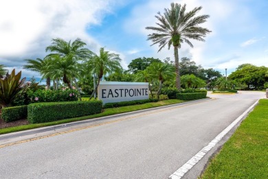 Wake up to stunning lake, golf course, and country club views in on Eastpointe Country Club in Florida - for sale on GolfHomes.com, golf home, golf lot