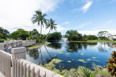 Wake up to stunning lake, golf course, and country club views in on Eastpointe Country Club in Florida - for sale on GolfHomes.com, golf home, golf lot