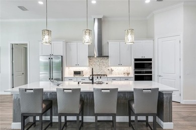 Sophisticated, serene, contemporary, and warm, this absolutely on The Golf Club At Fiddlers Creek in Florida - for sale on GolfHomes.com, golf home, golf lot