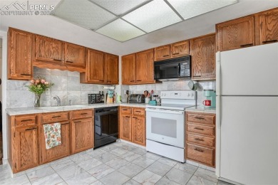 *SHORT SALE...SOLD AS IS*.  End unit offers Cheyenne Mountain on Country Club of Colorado in Colorado - for sale on GolfHomes.com, golf home, golf lot