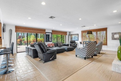 This thoughtfully cared for home offers 3 spacious bedrooms on Atlantis Golf Club in Florida - for sale on GolfHomes.com, golf home, golf lot