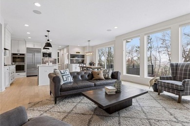 Experience modern luxury in this stunning custom-built Gonyea on Rush Creek Golf Club in Minnesota - for sale on GolfHomes.com, golf home, golf lot