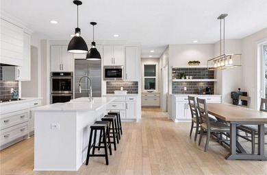 Experience modern luxury in this stunning custom-built Gonyea on Rush Creek Golf Club in Minnesota - for sale on GolfHomes.com, golf home, golf lot