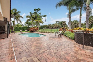 This thoughtfully cared for home offers 3 spacious bedrooms on Atlantis Golf Club in Florida - for sale on GolfHomes.com, golf home, golf lot