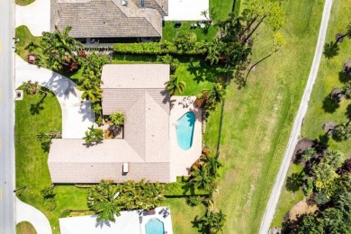 This thoughtfully cared for home offers 3 spacious bedrooms on Atlantis Golf Club in Florida - for sale on GolfHomes.com, golf home, golf lot