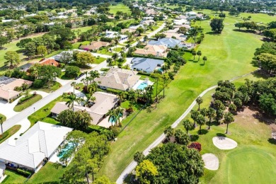 This thoughtfully cared for home offers 3 spacious bedrooms on Atlantis Golf Club in Florida - for sale on GolfHomes.com, golf home, golf lot